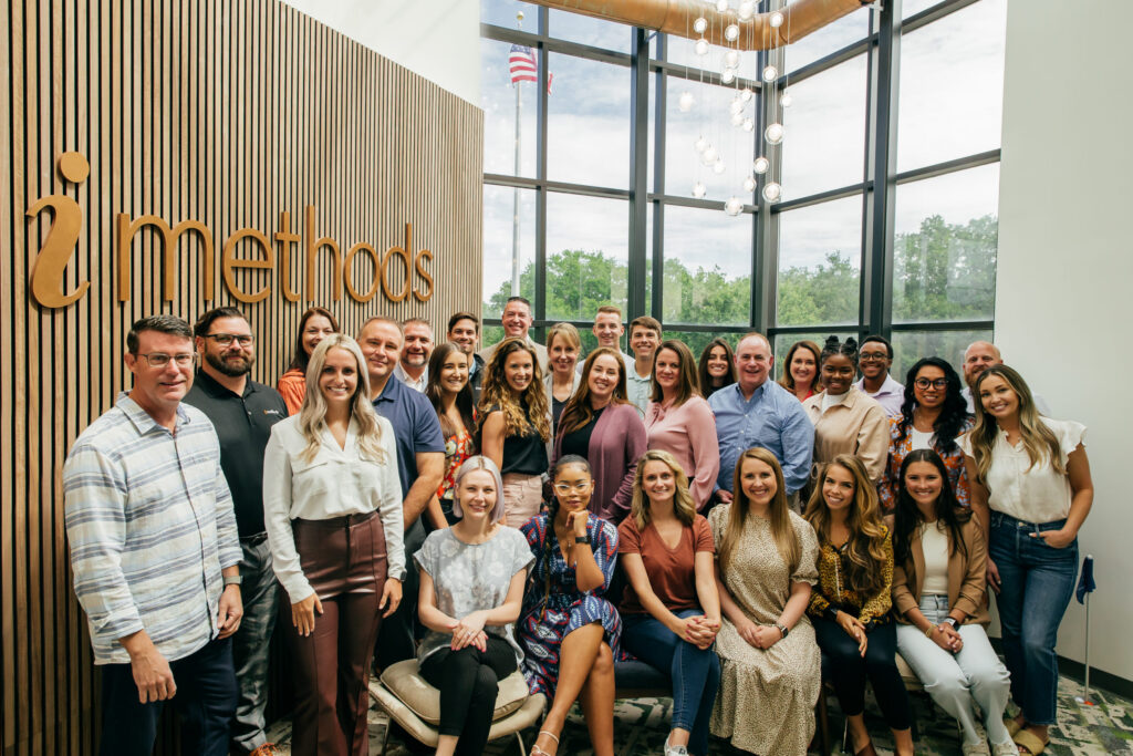 iMethods Team posing in our lobby